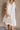 Haisley White Textured Floral Halter Mini Dress- close up front view