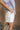 Phoebe White Pleated Shorts- close up side view