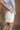 Phoebe White Pleated Shorts- close up side view