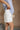 Phoebe White Pleated Shorts- frontal side view