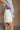 Phoebe White Pleated Shorts- frontal side view
