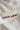 Image shows Kennedy Stars & Stripes Stud Set that have 3 pairs or studs; bows, circles, and stars. Studs are red white and blue with stripe details.