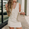 Front view of female model wearing the Isabella Cream Button-Up Vest which features Cream Lightweight Fabric,  Cropped Waist, Monochrome Button Up, V-Neckline and Sleeveless