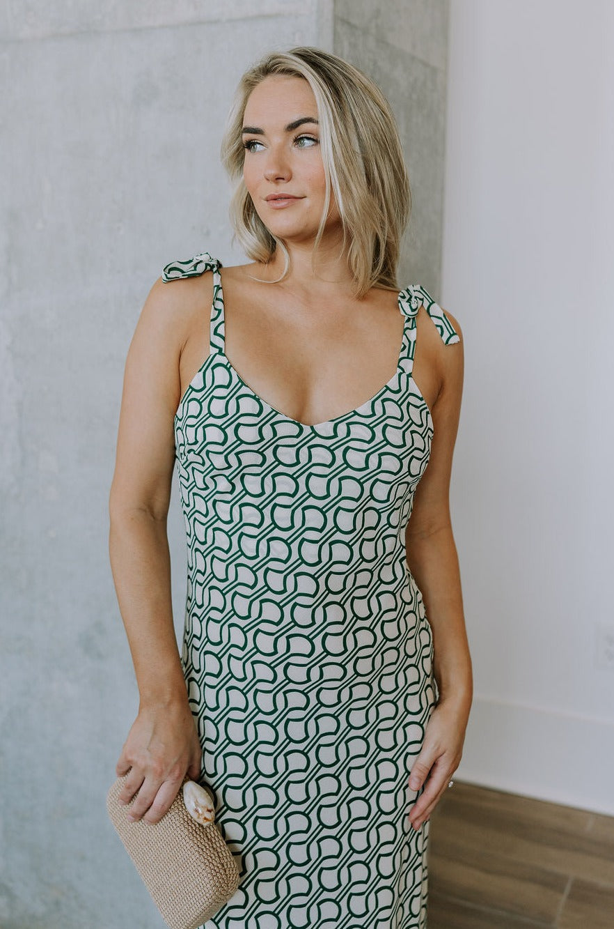 front view of female model wearing the Selena Green & Cream Tie Straps Midi Dress which features Green and Cream Lightweight Fabric, Geometric Pattern, Midi Length, Sweetheart Neckline and Tie Straps