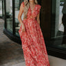Full body view of female model wearing the Adalyn Pink & Red Paisley Cut-Out Maxi Dress which features Red, Pink and Peach Paisley Print,  Side Ruffle Slits, Peach Thigh Length Lining, Maxi Length, Elastic Waistband, Side Cutouts with Rattan Buckle, Plunge Neckline, Ruffle Straps  andTie Back Closure