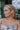 Side view of a model wearing the Drew Chain Earrings in Gold