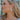 Side view of female model wearing the Myra Iridescent Hoop Earrings that have white iridescent material.