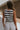 back view of female model wearing the Mallory Off White & Black Stripe Tank which features White and Black Stripe Pattern, Round Neckline, Cropped Waist and Sleeveless