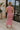 Full body back view of female model wearing the Delilah Red & White Striped Midi DressDelilah Red & White Striped Midi Dress that has horizontal red and white stripes, a round neck, sleeveless, and midi hem.