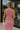 Upper body back view of female model wearing the Delilah Red & White Striped Midi DressDelilah Red & White Striped Midi Dress that has horizontal red and white stripes, a round neck, sleeveless, and midi hem.