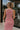 Upper body back view of female model wearing the Delilah Red & White Striped Midi DressDelilah Red & White Striped Midi Dress that has horizontal red and white stripes, a round neck, sleeveless, and midi hem.