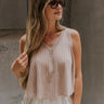 Upper body front view of female model wearing the Jordyn Taupe Tank Top that has taupe knit fabric, a v neck, and cropped scooped hem.