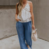 Full body view of female model wearing the Leona Linen Fray Cropped Pants which features Lightweight Fabric, Wide Cropped Leg, Fray Hem Details, Two Front Pockets and Elastic Waistband. the pants are available in blue, green and white.