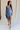 Full body view of female model wearing the Azlynn Blue Satin Cowl Neckline Dress which features Blue Satin Fabric, Overlay Hem Detail, Ruched Detail, Cowl Neckline with Adjustable Straps and Side Monochrome Zipper with Hook Closure