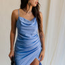 front view of female model wearing the Azlynn Blue Satin Cowl Neckline Dress which features Blue Satin Fabric, Overlay Hem Detail, Ruched Detail, Cowl Neckline with Adjustable Straps and Side Monochrome Zipper with Hook Closure