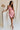 Full body view of female model wearing the Eliza Pink Square Neckline Mini Dress which features Lightweight Pink Fabric, Pink Lining, Mini Length, Square Neckline, Sleeveless and Monochrome Back Zipper with Hook Closure