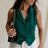 front view of female model wearing the Reign Hunter Green Buttoned Vest which features Hunter Green Lightweight Fabric, Monochrome Button Up, Collared Neckline and Sleeveless