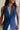 close up view of female model wearing the Faye Blue Buttoned Vest which features Blue Lightweight Fabric, Monochrome Button Closure, Collared Neckline and Sleeveless