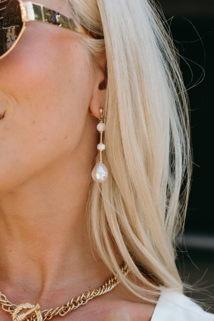 Morgana Pearl Dangle Earrings - close up view on model