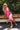 Leila Pink & Red Tropical Midi Dress - model sitting - front view