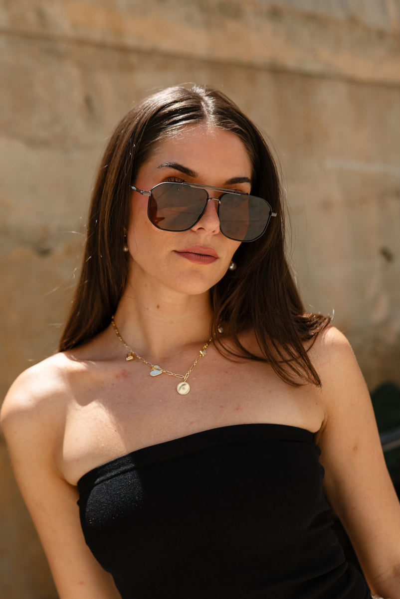 Regan Sunglasses in Brown - front view on model
