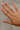 Leslie Gold Dipped Rhinestone Ring - close up view on models hand