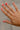 Leslie Gold Dipped Rhinestone Ring - close up view on models hand