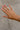 Leslie Gold Dipped Rhinestone Ring - top view on models hand