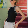 Front view of Ashley Halter Tank in black with white trim, ribbed sleeveless tank with halter neckline. 