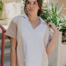 Close up front view of Malia Multi-Color Short Sleeve Top that is taupe, mocha, and grey, with a V and collared neckline, beautiful detailing of a heart on the back.