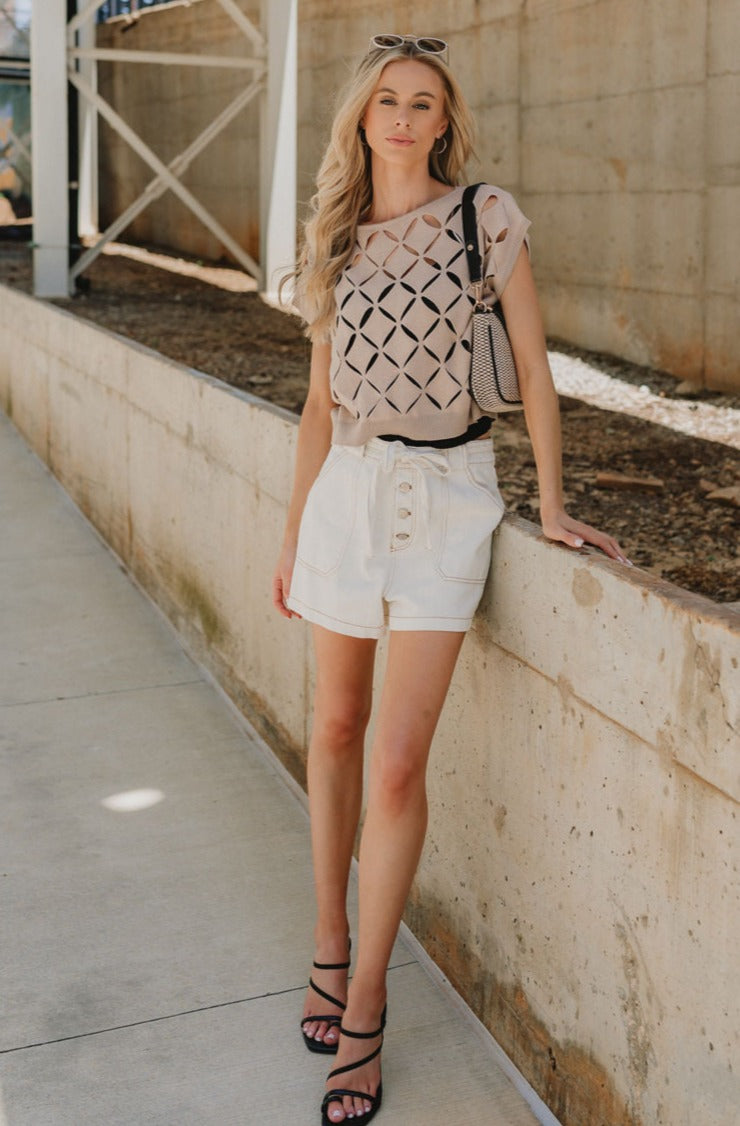 Full body front view of Emme Taupe Short Sleeve Top that has cut out details throughout.