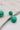 Close up view of the Sierra Green Rattan Dangle Earring which features turquoise rattan dangle ball earrings with gold details