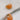 Close up view of the Sophie Peach Scoop Hoop Earring which features peach scooped mini hoops