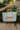 Summer Aqua & Orange Tote Bag - front view of model holding in front of palm leaves