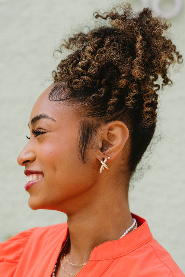 Tiana Gold & Pearl Criss Cross Earrings - side view of earrings on model