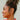 Tiana Gold & Pearl Criss Cross Earrings - side view of earrings on model