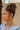 Sami Hammered Gold Hoop Earrings - side view of earrings on model
