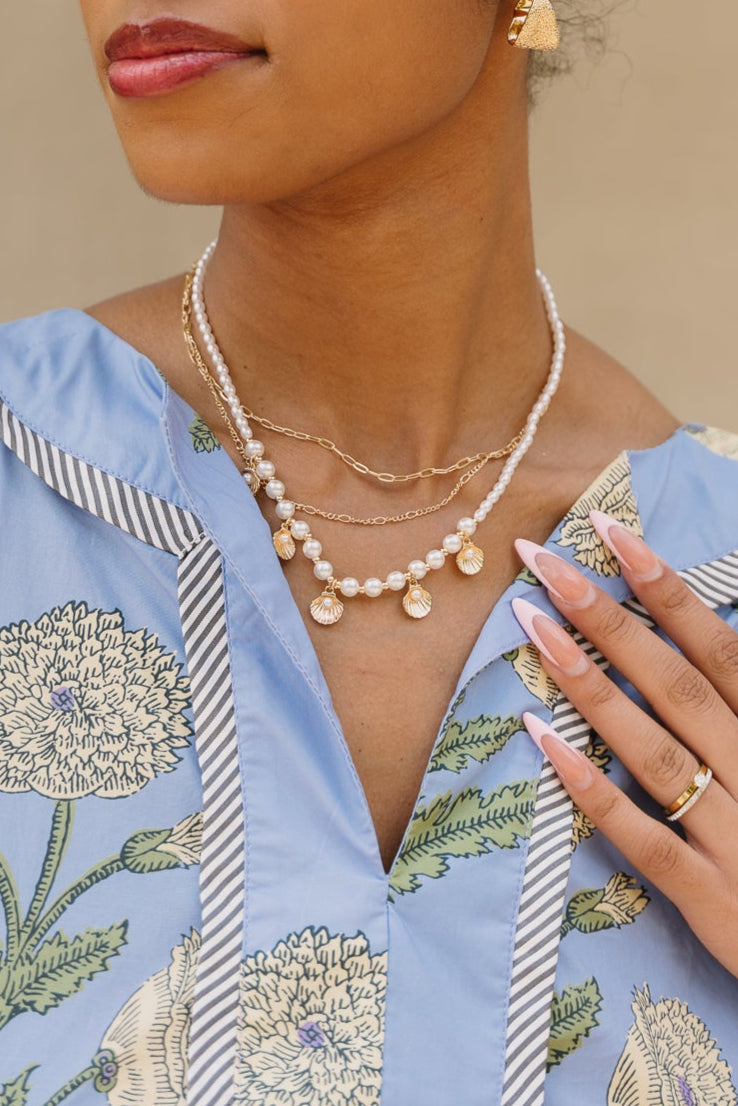 Kelly Layered Pearl & Seashell Necklace - frontal view on model