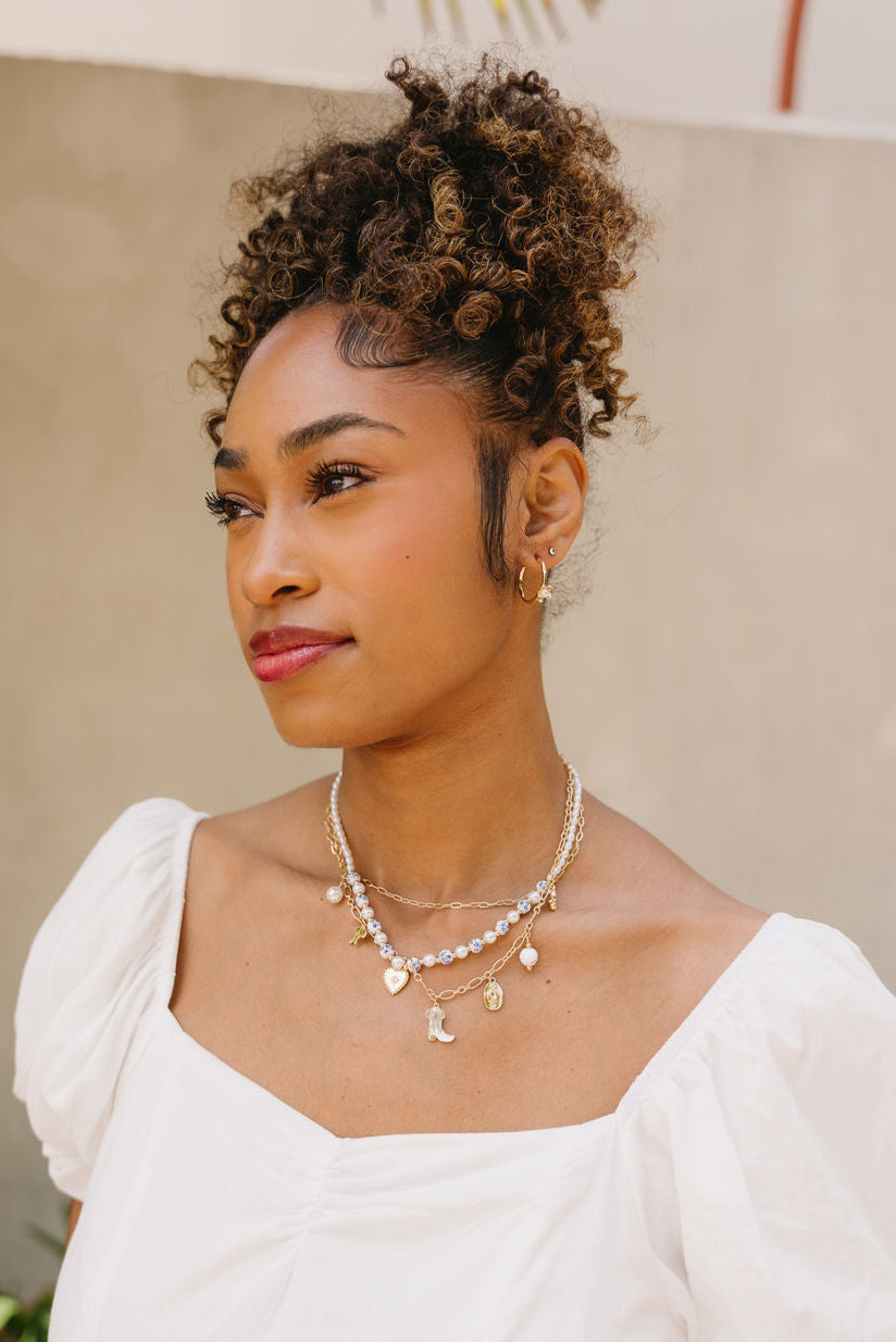 Margot Layered Floral Bead & Charm Necklace - frontal side view on model