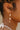 Hillary Floral Beaded & Bow Dangle Earrings - close up on model