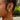 Giselle Gold & Turquoise Earrings - close up of earrings on model