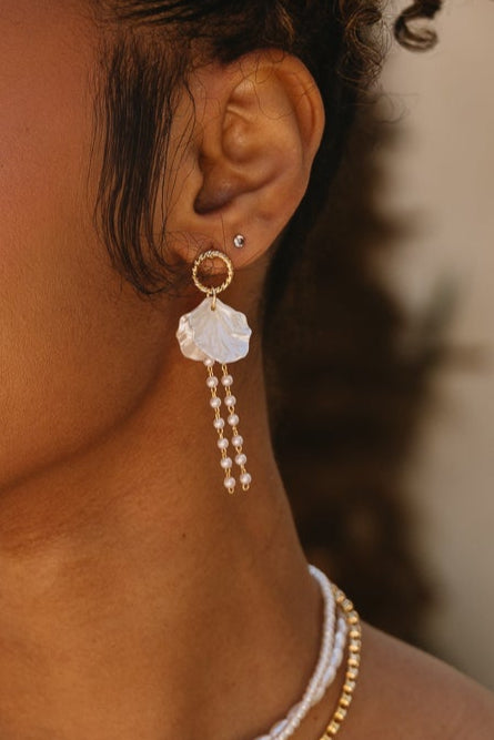 Jesslyn White Petal & Pearl Earrings - close up of model wearing earrings