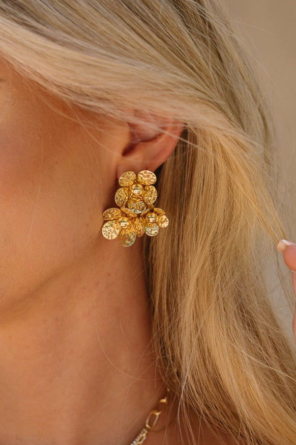Jemma Gold Flower Stud Earrings - close up of earrings on model