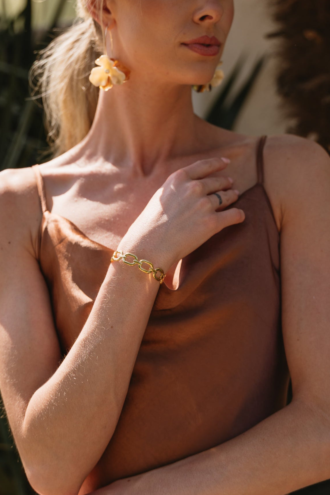 Kylie Gold Chain Bangle Cuff - close up - shown  on model's wrist