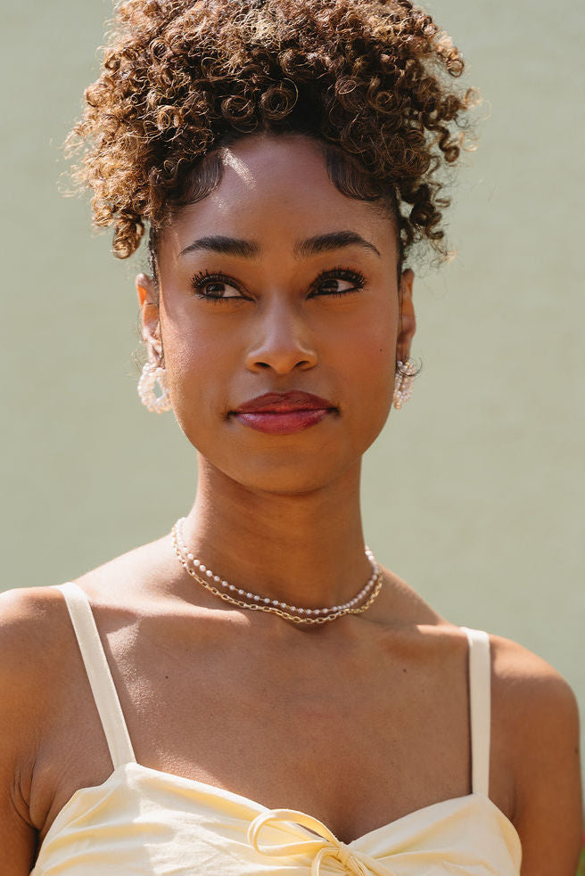 Paloma Twisted Pearl Earrings - front view of model wearing earrings