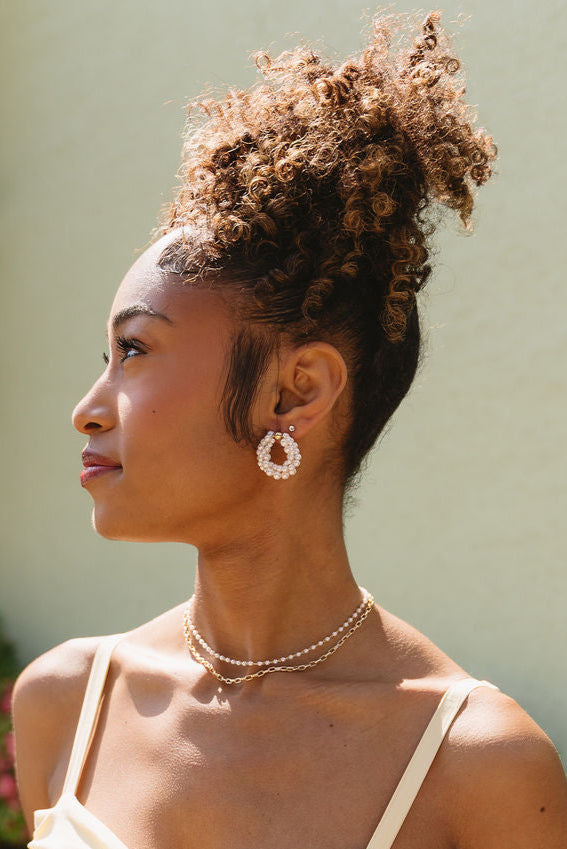 Paloma Twisted Pearl Earrings - side view of model wearing earrings