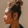 Bianca Gold Twisted Knot Earrings - side view of model wearing earrings
