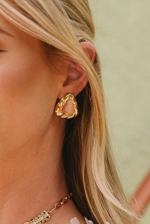 Cameron Gold & Pink Triangle Stud Earrings - close up of earrings on model