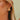 Cameron Gold & Pink Triangle Stud Earrings - close up of earrings on model