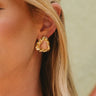 Cameron Gold & Pink Triangle Stud Earrings - close up of earrings on model